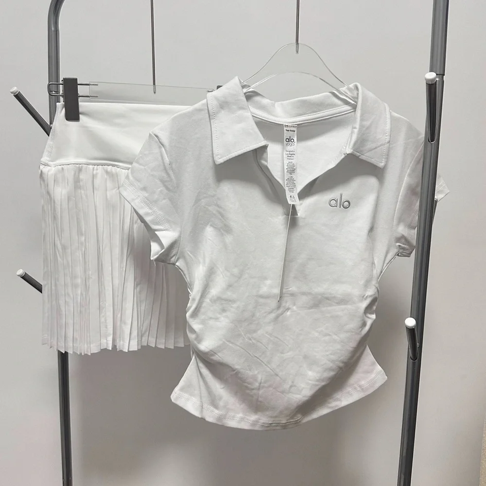 ALO Yoga Women's White Tennis Short Sleeved Top With Pleated Skirt Set